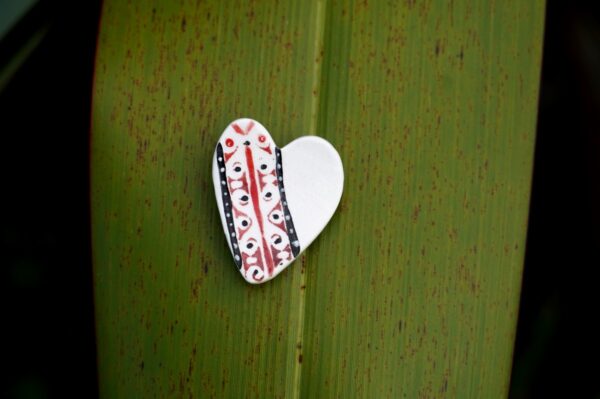 porcelain brooch with New Zealand symbols