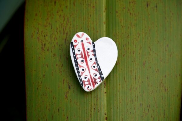porcelain brooch with New Zealand symbols