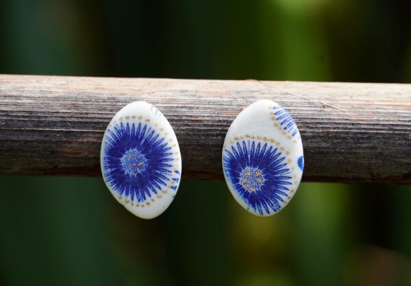 Each piece is handmade from porcelain clay and fired twice or three times in the kiln around 1200 degrees. Pottery is my passion and I love to discover new techniques, glazes, oxides or materials to play with and make extraordinary high quality jewellery. I also use hypoallergenic stainless steel and lsilver studs/hooks.