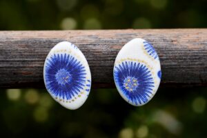 Each piece is handmade from porcelain clay and fired twice or three times in the kiln around 1200 degrees. Pottery is my passion and I love to discover new techniques, glazes, oxides or materials to play with and make extraordinary high quality jewellery. I also use hypoallergenic stainless steel and silver studs/hooks.