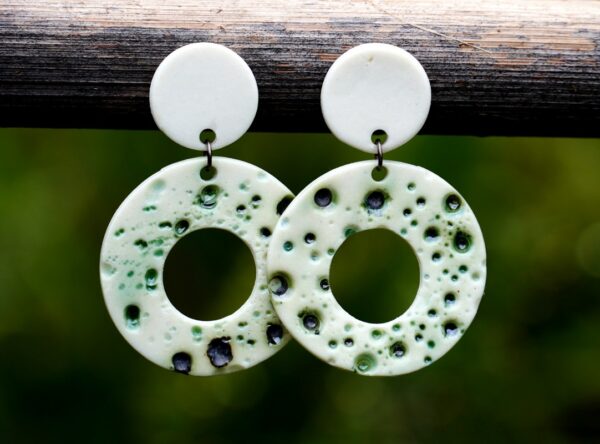 Each piece is handmade from porcelain clay and fired twice or three times in the kiln around 1200 degrees. Pottery is my passion and I love to discover new techniques, glazes, oxides or materials to play with and make extraordinary high quality jewellery. I also use hypoallergenic stainless steel and silver studs/hooks.