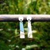 Each piece is handmade from porcelain clay and fired twice or three times in the kiln around 1200 degrees. Pottery is my passion and I love to discover new techniques, glazes, oxides or materials to play with and make extraordinary high quality jewellery. I also use hypoallergenic stainless steel and silver studs/hooks.