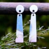 Each piece is handmade from porcelain clay and fired twice or three times in the kiln around 1200 degrees. Pottery is my passion and I love to discover new techniques, glazes, oxides or materials to play with and make extraordinary high quality jewellery. I also use hypoallergenic stainless steel and silver studs/hooks.