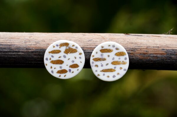 Each piece is handmade from porcelain clay and fired twice or three times in the kiln around 1200 degrees. Pottery is my passion and I love to discover new techniques, glazes, oxides or materials to play with and make extraordinary high quality jewellery. I also use hypoallergenic stainless steel and silver studs/hooks.