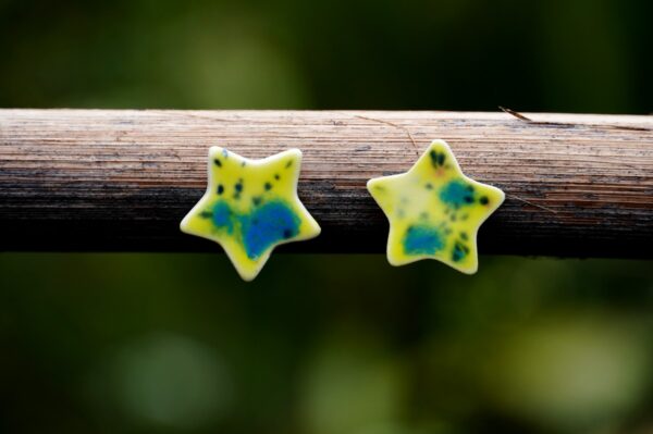 Each piece is handmade from porcelain clay and fired twice or three times in the kiln around 1200 degrees. Pottery is my passion and I love to discover new techniques, glazes, oxides or materials to play with and make extraordinary high quality jewellery. I also use hypoallergenic stainless steel and silver studs/hooks.