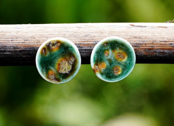 Each piece is handmade from porcelain clay and fired twice or three times in the kiln around 1200 degrees. Pottery is my passion and I love to discover new techniques, glazes, oxides or materials to play with and make extraordinary high quality jewellery. I also use hypoallergenic stainless steel and silver studs/hooks.