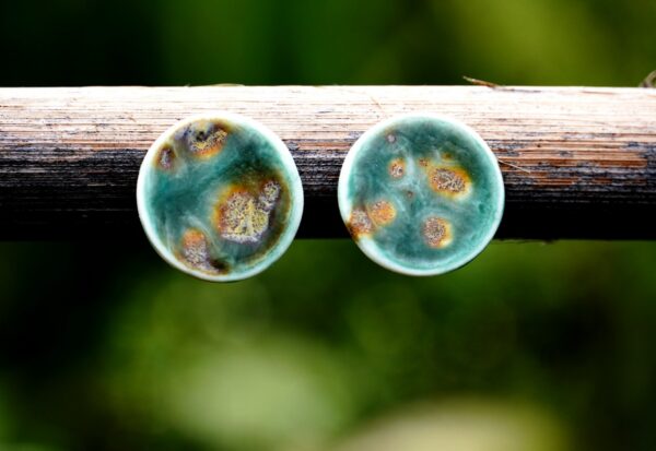 Each piece is handmade from porcelain clay and fired twice or three times in the kiln around 1200 degrees. Pottery is my passion and I love to discover new techniques, glazes, oxides or materials to play with and make extraordinary high quality jewellery. I also use hypoallergenic stainless steel and silver studs/hooks.