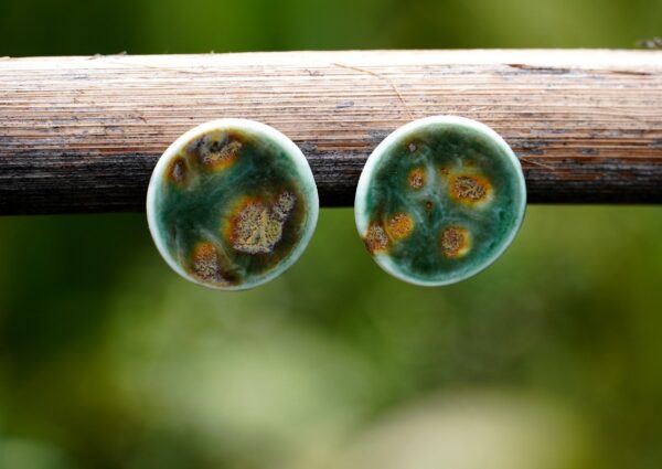 Each piece is handmade from porcelain clay and fired twice or three times in the kiln around 1200 degrees. Pottery is my passion and I love to discover new techniques, glazes, oxides or materials to play with and make extraordinary high quality jewellery. I also use hypoallergenic stainless steel and silver studs/hooks.