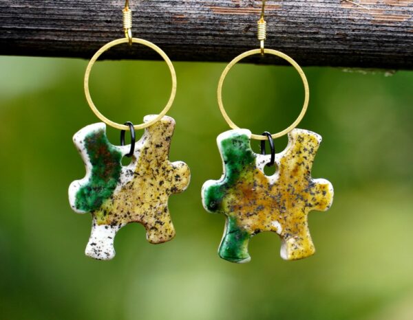 Each piece is handmade from porcelain clay and fired twice or three times in the kiln around 1200 degrees. Pottery is my passion and I love to discover new techniques, glazes, oxides or materials to play with and make extraordinary high quality jewellery. I also use hypoallergenic stainless steel and silver studs/hooks.