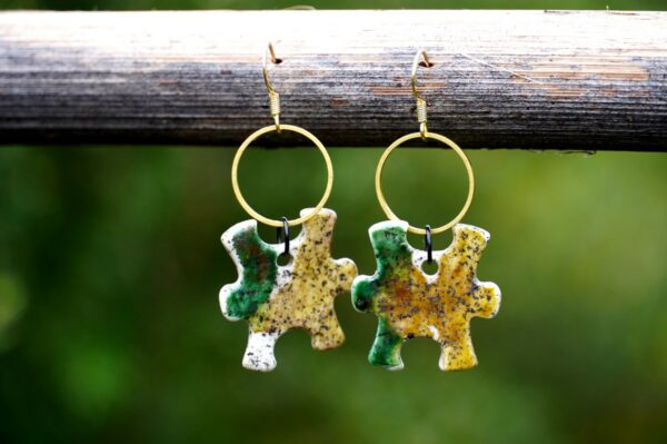 Each piece is handmade from porcelain clay and fired twice or three times in the kiln around 1200 degrees. Pottery is my passion and I love to discover new techniques, glazes, oxides or materials to play with and make extraordinary high quality jewellery. I also use hypoallergenic stainless steel and silver studs/hooks.
