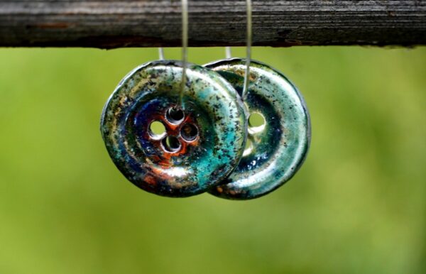 Each piece is handmade from porcelain clay and fired twice or three times in the kiln around 1200 degrees. Pottery is my passion and I love to discover new techniques, glazes, oxides or materials to play with and make extraordinary high quality jewellery. I also use hypoallergenic stainless steel and silver studs/hooks.