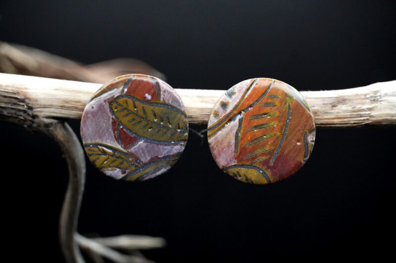 Porcelain jewelry that tells a story – handcrafted black porcelain earrings using sgraffito technique.”Each piece is handmade from porcelain clay and fired twice or three times in the kiln around 1200 degrees. Pottery is my passion and I love to discover new techniques, glazes, oxides or materials to play with and make extraordinary high quality jewellery. I also use hypoallergenic stainless steel and silver studs/hooks.