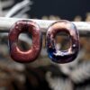 Handcrafted porcelain Raku earrings. Each piece is handmade from porcelain clay and fired twice or three times in the kiln around 1200 degrees. Pottery is my passion and I love to discover new techniques, glazes, oxides or materials to play with and make extraordinary high quality jewellery. I also use hypoallergenic stainless steel and silver studs/hooks.