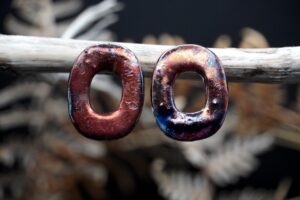 Handcrafted porcelain Raku earrings. Each piece is handmade from porcelain clay and fired twice or three times in the kiln around 1200 degrees. Pottery is my passion and I love to discover new techniques, glazes, oxides or materials to play with and make extraordinary high quality jewellery. I also use hypoallergenic stainless steel and silver studs/hooks.