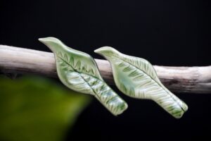Each piece is handmade from porcelain clay and fired twice or three times in the kiln around 1200 degrees. Pottery is my passion and I love to discover new techniques, glazes, oxides or materials to play with and make extraordinary high quality jewellery. I also use hypoallergenic stainless steel and silver studs/hooks. Porcelain Tui bird earrings.