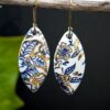 Each piece is handmade from porcelain clay and fired twice or three times in the kiln around 1200 degrees. Pottery is my passion and I love to discover new techniques, glazes, oxides or materials to play with and make extraordinary high quality jewellery. I also use hypoallergenic stainless steel and silver studs/hooks. Blue print gold luster earrings