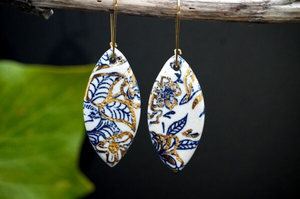 Each piece is handmade from porcelain clay and fired twice or three times in the kiln around 1200 degrees. Pottery is my passion and I love to discover new techniques, glazes, oxides or materials to play with and make extraordinary high quality jewellery. I also use hypoallergenic stainless steel and silver studs/hooks. Blue print gold luster earrings