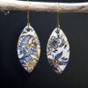 Each piece is handmade from porcelain clay and fired twice or three times in the kiln around 1200 degrees. Pottery is my passion and I love to discover new techniques, glazes, oxides or materials to play with and make extraordinary high quality jewellery. I also use hypoallergenic stainless steel and silver studs/hooks. Blue print gold luster earrings.