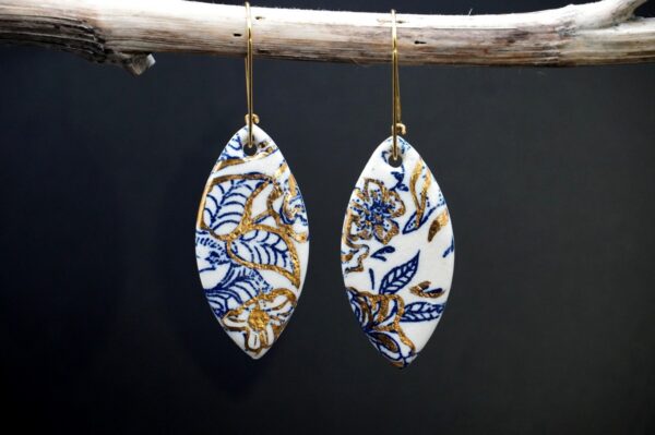Each piece is handmade from porcelain clay and fired twice or three times in the kiln around 1200 degrees. Pottery is my passion and I love to discover new techniques, glazes, oxides or materials to play with and make extraordinary high quality jewellery. I also use hypoallergenic stainless steel and silver studs/hooks. Blue print gold luster earrings.
