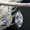 Each piece is handmade from porcelain clay and fired twice or three times in the kiln around 1200 degrees. Pottery is my passion and I love to discover new techniques, glazes, oxides or materials to play with and make extraordinary high quality jewellery. I also use hypoallergenic stainless steel and silver studs/hooks. Blue print gold luster earrings.