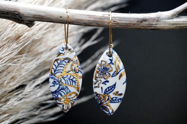 Each piece is handmade from porcelain clay and fired twice or three times in the kiln around 1200 degrees. Pottery is my passion and I love to discover new techniques, glazes, oxides or materials to play with and make extraordinary high quality jewellery. I also use hypoallergenic stainless steel and silver studs/hooks. Blue print gold luster earrings.
