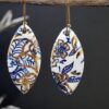 Each piece is handmade from porcelain clay and fired twice or three times in the kiln around 1200 degrees. Pottery is my passion and I love to discover new techniques, glazes, oxides or materials to play with and make extraordinary high quality jewellery. I also use hypoallergenic stainless steel and silver studs/hooks. Blue print gold luster earrings.