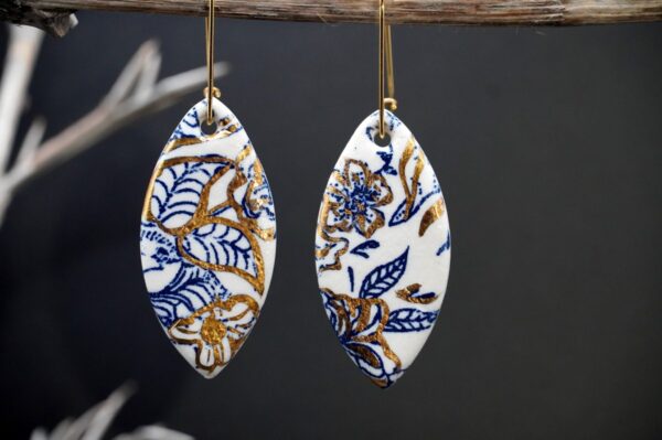 Each piece is handmade from porcelain clay and fired twice or three times in the kiln around 1200 degrees. Pottery is my passion and I love to discover new techniques, glazes, oxides or materials to play with and make extraordinary high quality jewellery. I also use hypoallergenic stainless steel and silver studs/hooks. Blue print gold luster earrings.