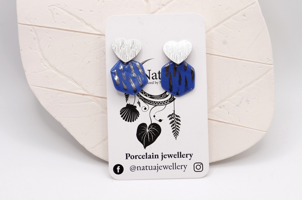 Each piece is handmade from porcelain clay and fired twice or three times in the kiln around 1200 degrees. Pottery is my passion and I love to discover new techniques, glazes, oxides or materials to play with and make extraordinary high quality jewellery. I also use hypoallergenic stainless steel and silver studs/hooks.