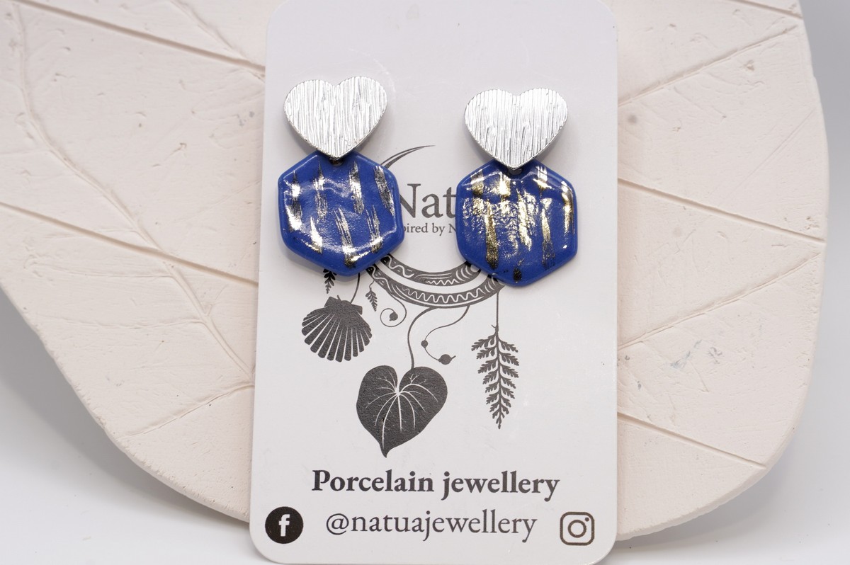 Each piece is handmade from porcelain clay and fired twice or three times in the kiln around 1200 degrees. Pottery is my passion and I love to discover new techniques, glazes, oxides or materials to play with and make extraordinary high quality jewellery. I also use hypoallergenic stainless steel and silver studs/hooks.